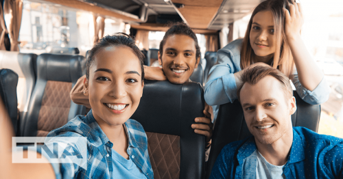 Four Young People Taking a Selfie on a Private Bus Charter