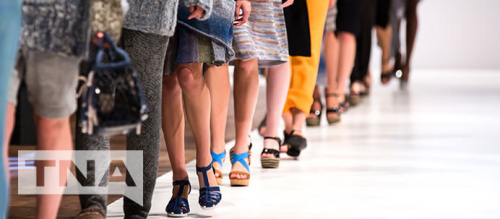 Models walking down the runway at a fashion show