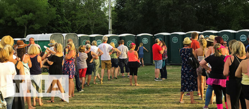 Outdoor concert huge line up for toilets