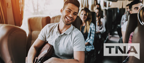 Smiling Male Charter Bus Passenger