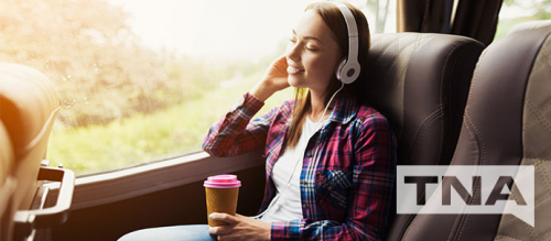 Woman listening to music on a private charter bus